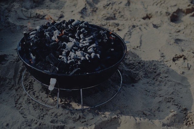 charcoal smoker on sandy beach