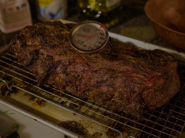meat thermometer sticking out of roast reading temperature