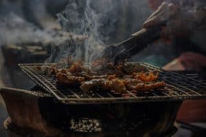 close up of meat being smoked