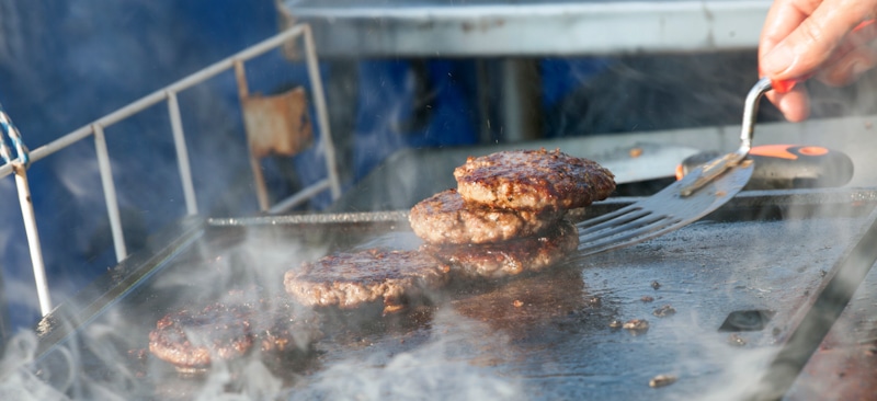 gas grill with burgers